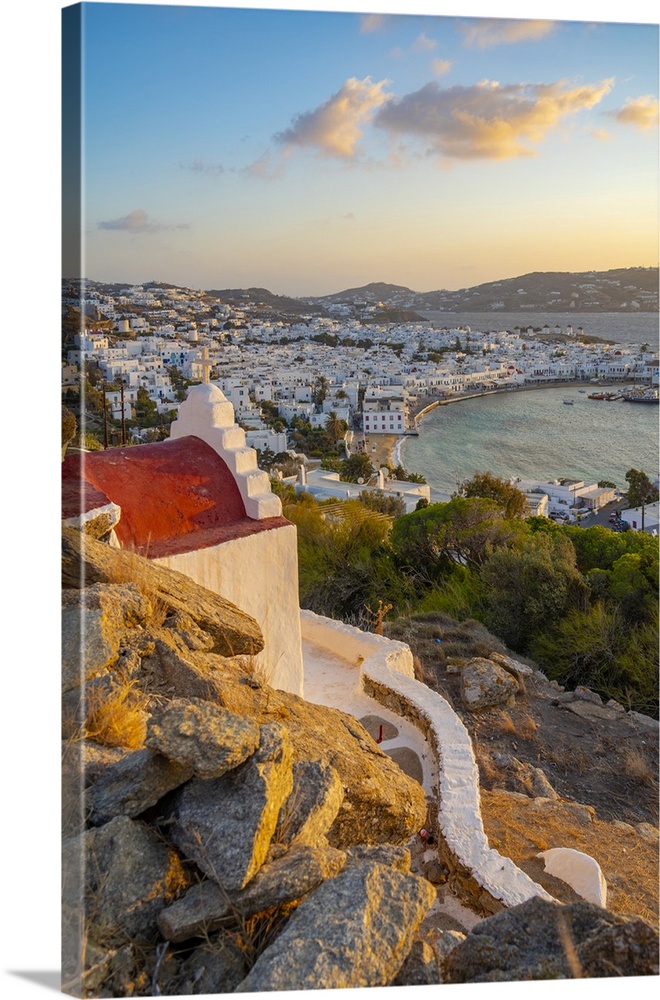 View of chapel and town from elevated view point at sunset, Mykonos Town, Mykonos, Cyclades Islands, Greek Islands, Aegean...