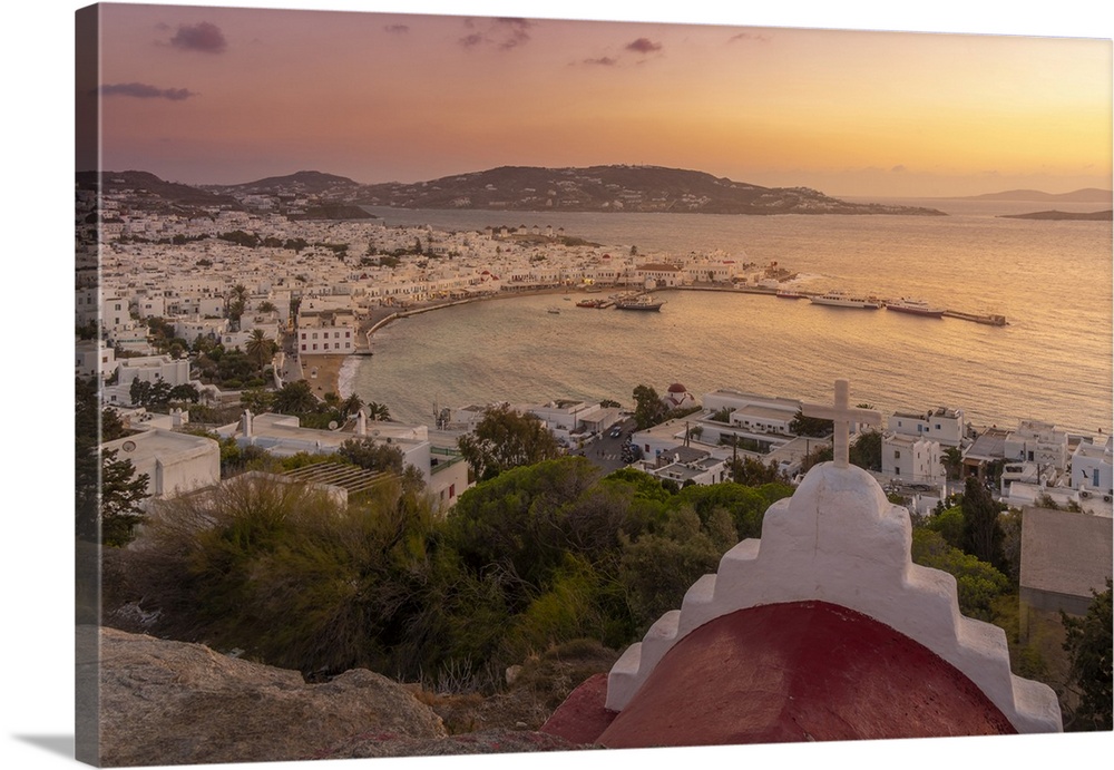 View of chapel and town from elevated view point at sunset, Mykonos Town, Mykonos, Cyclades Islands, Greek Islands, Aegean...