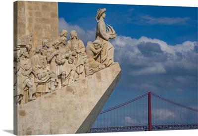 View Of Monument To The Discoveries And 25 April Bridge On A Sunny Day, Lisbon, Portugal