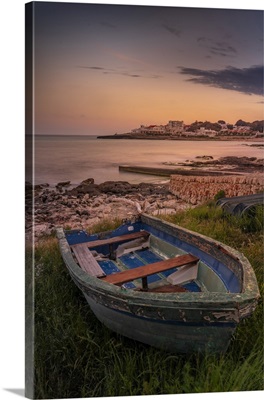 View Of Playa Punta Prima And Rowing Boat At Dusk, Balearic Islands, Spain
