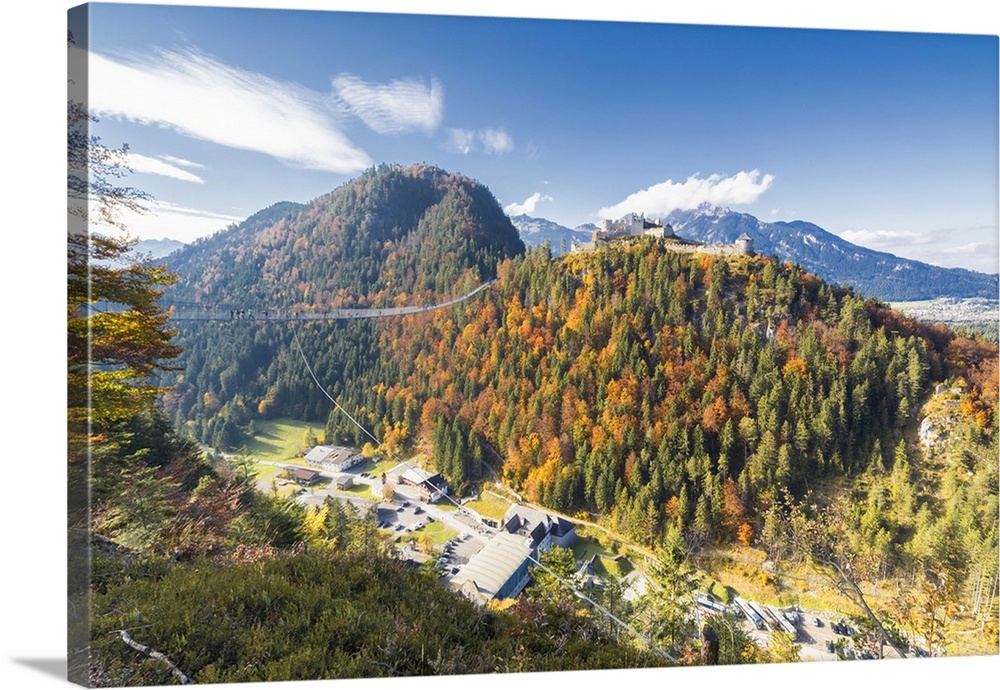 View of the old Ehrenberg Castle surrounded by colorful woods and suspension bridge, Highline 179, Reutte, Austria