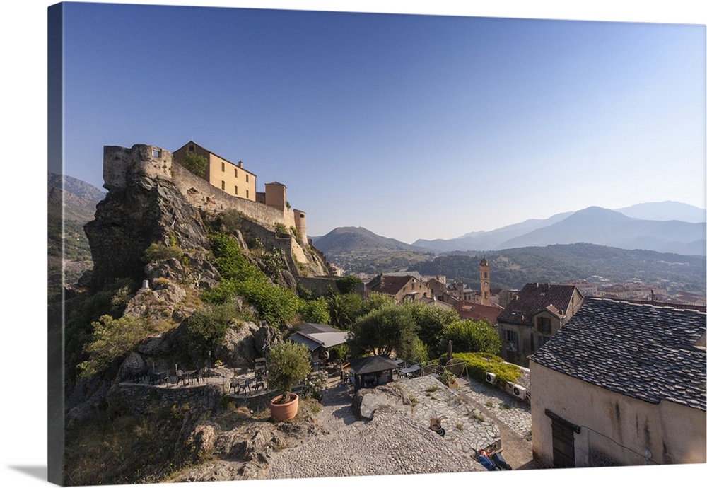 View of the old town of citadel of Corte perched on the hill surrounded by mountains, Haute-Corse, Corsica, France