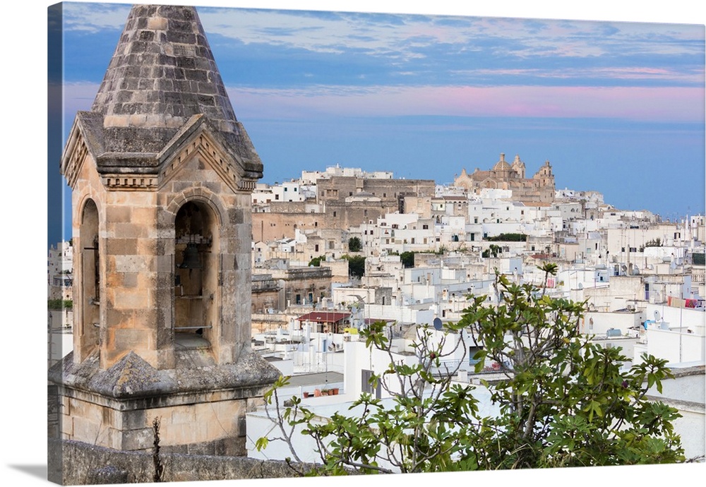 View of typical architecture and white houses of the old medieval town at sunset, Ostuni, Province of Brindisi, Apulia, Italy