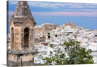 View of typical architecture of the old medieval town at sunset, Ostuni, Italy