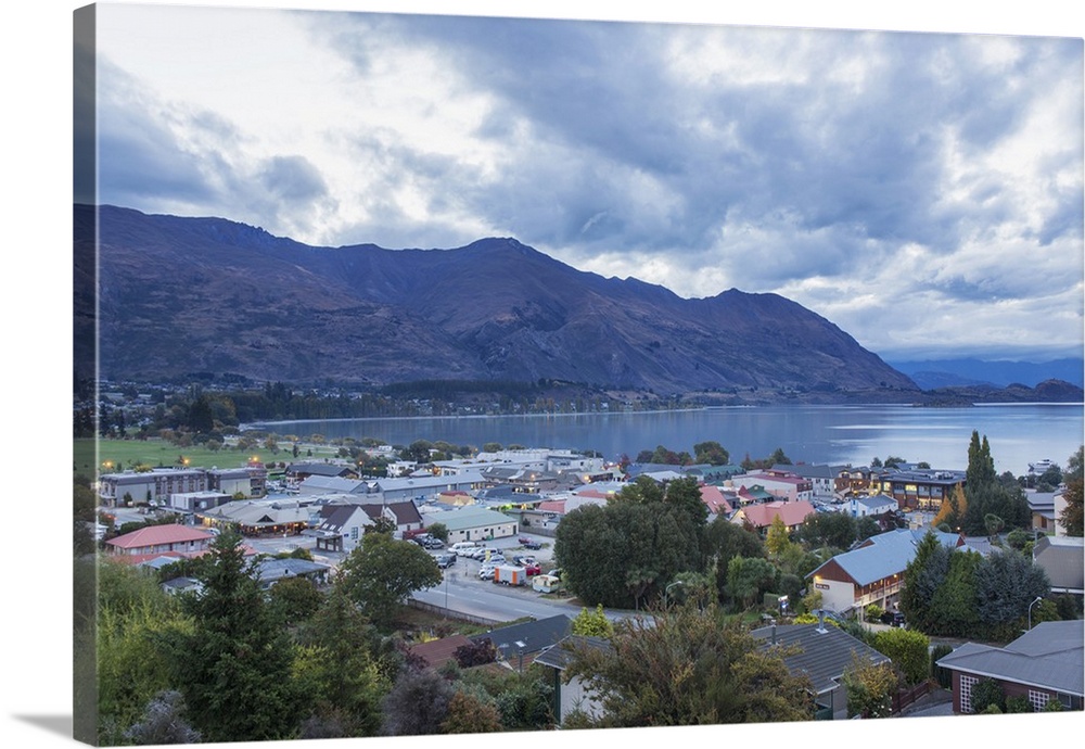 View over rooftops to Lake Wanaka at dusk, Wanaka, Queenstown-Lakes district, Otago, South Island, New Zealand, Pacific