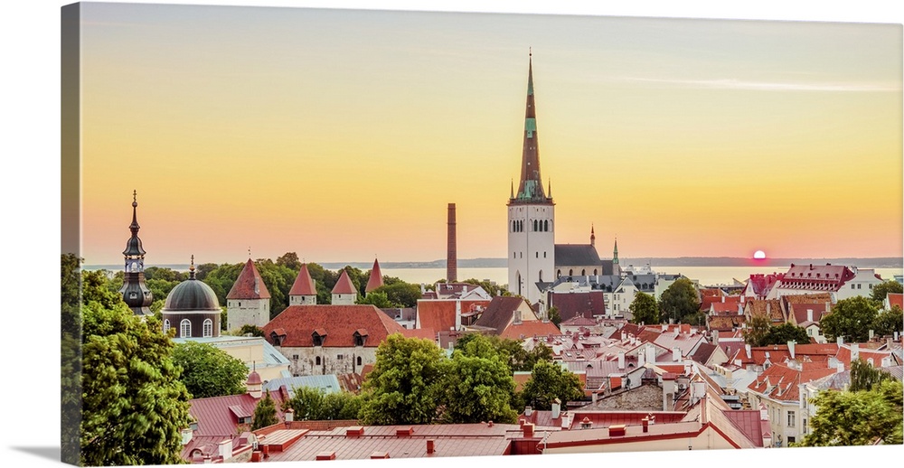 View over the Old Town towards St. Olaf's Church at sunrise, UNESCO World Heritage Site, Tallinn, Estonia, Europe