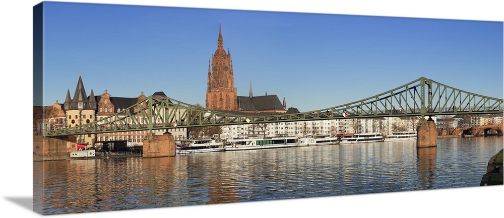 View over Main River to Eiserner Steg iron footbridge and Kaiserdom Cathedral of St. Bartholomew, Frankfurt, Hesse, German...