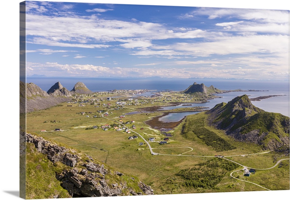 View of village of Sorland framed by green meadows and sea, Vaeroy Island, Nordland county, Lofoten archipelago, Norway, S...