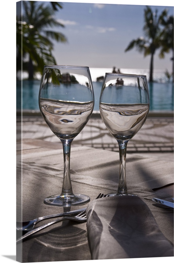 Wine glasses in front of the pool of the Beachcomber Le Paradis, Mauritius, Africa
