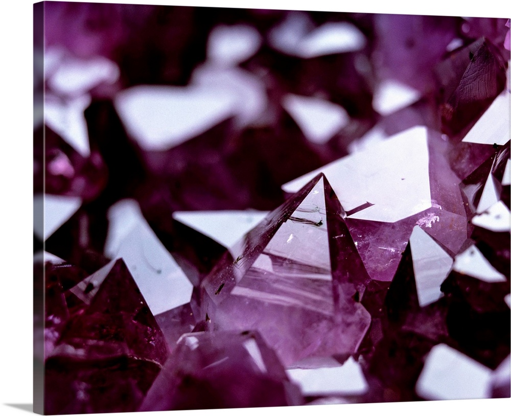 Amethyst crystals, a variety of quartz, (silicon dioxide). The purple colour in amethysts is caused by the presence of com...