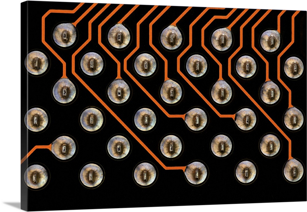 Circuit board. Light micrograph of tin contacts and tracks (orange)on a multilayer printed circuit board (PCB). These cont...