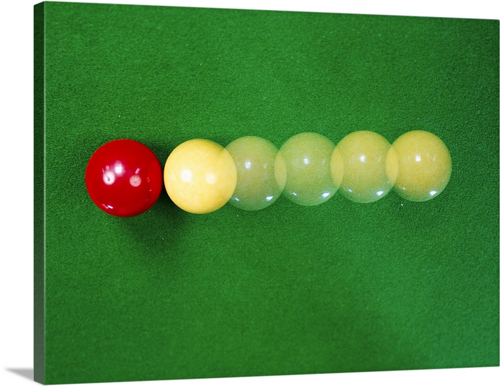 Billiard balls colliding, demonstrating principles such as conservation of momentum, and Newton's Laws of Motion.
