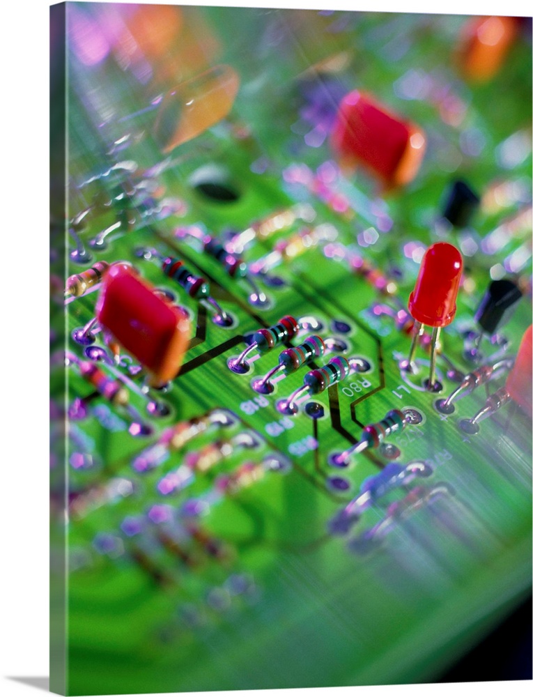 Circuit board. Close-up view of an electronic circuit board, showing resistors (centre), a Light Emitting Diode (LED, cent...