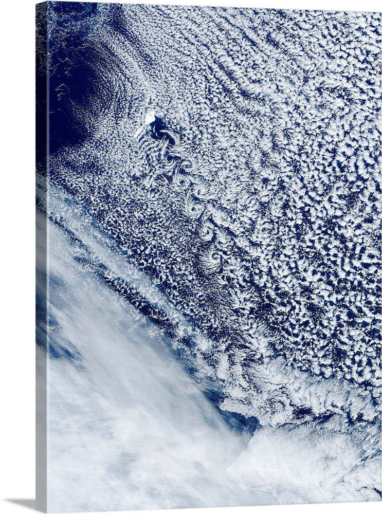 Cloud vortex street, satellite image. North is at top. The island of Jan Mayen (white, upper left) is located in the Arcti...