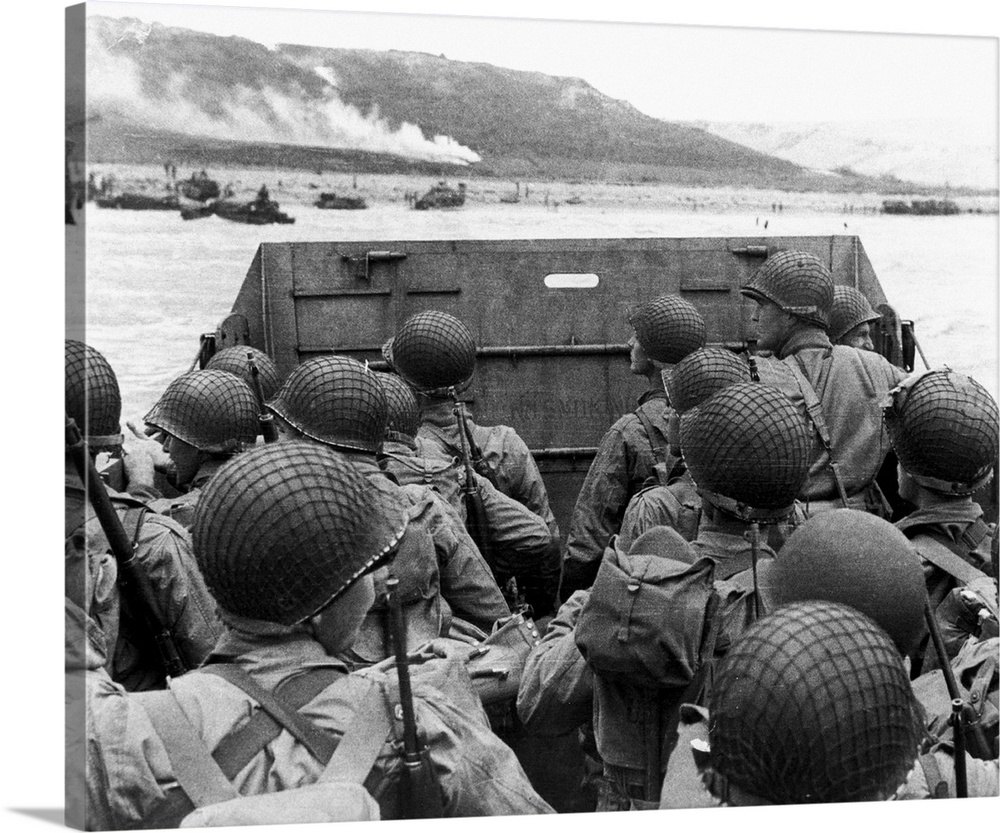 D-Day landings. US assault troops in a landing craft behind its protective shield as it nears a beachhead on the northern ...