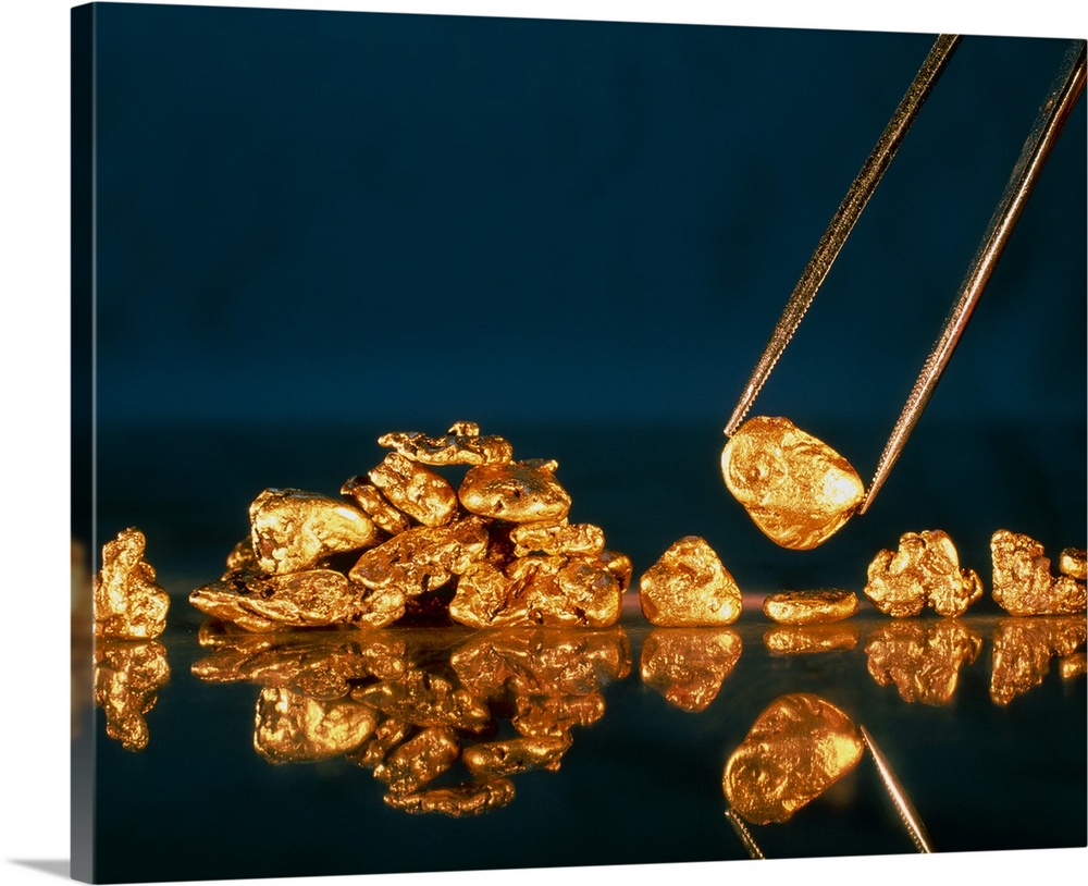 Gold. Nuggets made of gold. Gold is the 79th element of the periodic table, and has a relative atomic mass of 196.97. It h...