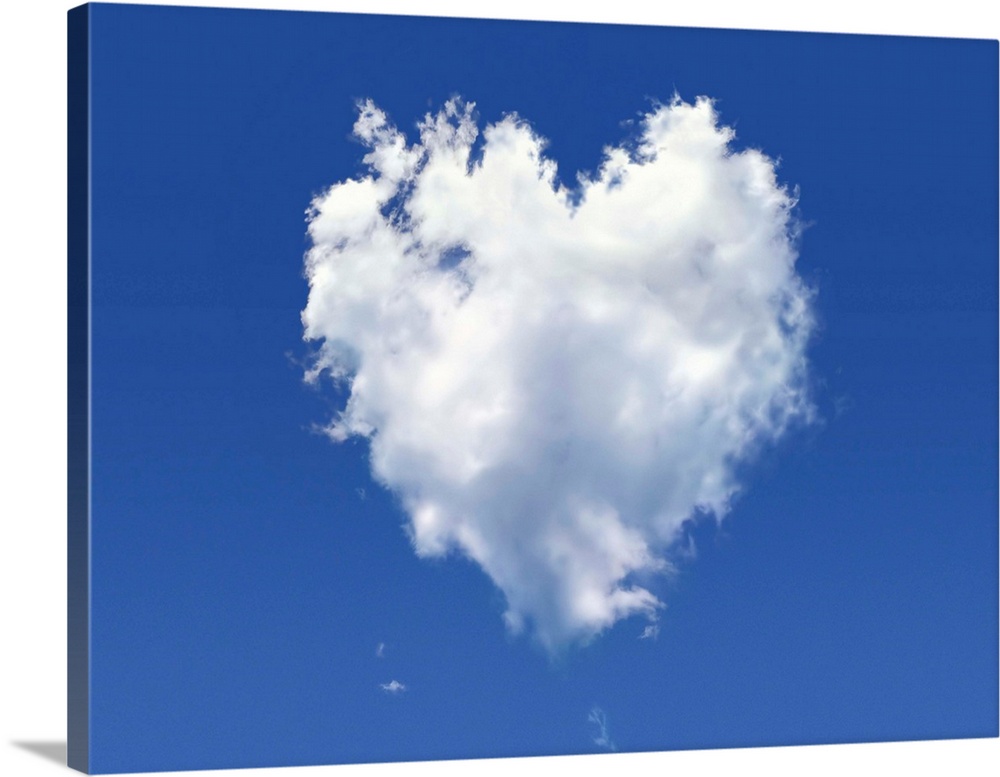 Heart shaped cloud against a blue sky, computer artwork.