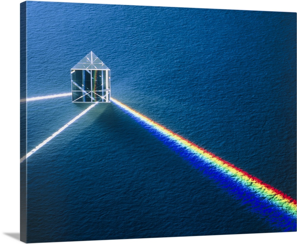 A prism demonstrating refraction and reflection effects. A beam of white light strikes the prism, refracting onto the righ...
