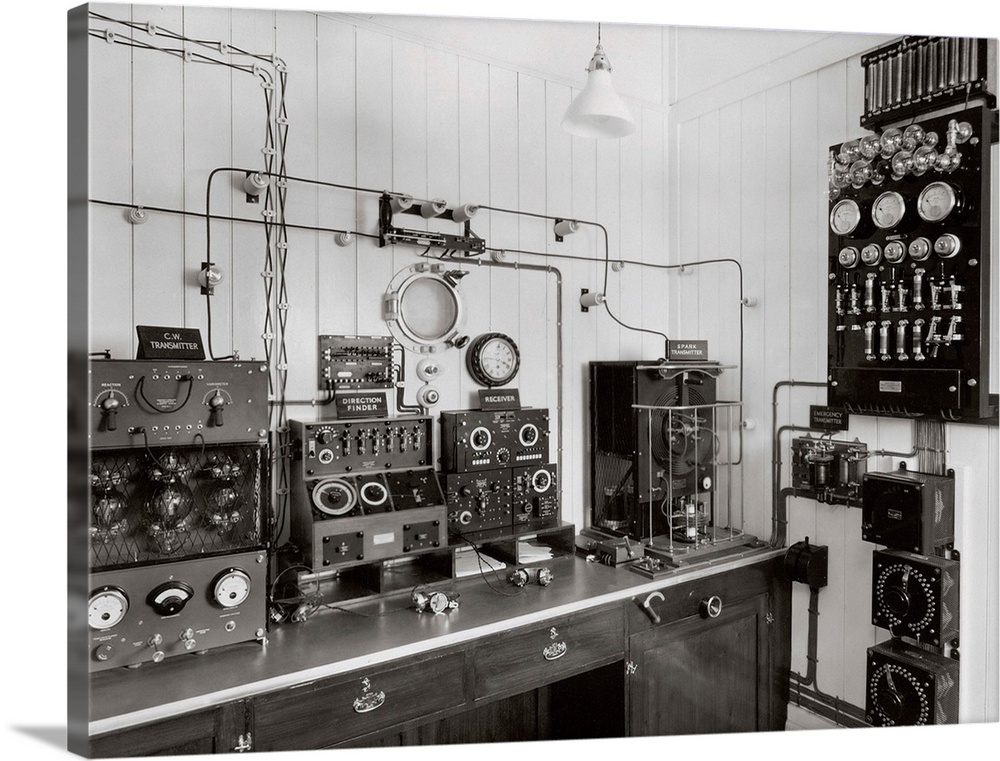 Marconi radio equipment on a ship. The equipment includes headphones and a Morse code key (lower centre). The equipment is...