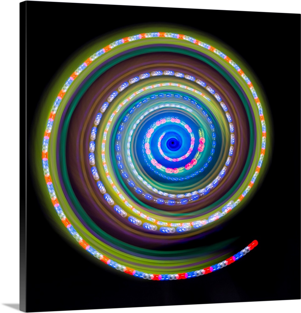 Multicoloured spinning light trails.