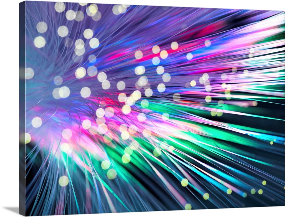 Optical fibres emitting light. Optical fibres are used in telecommunications to transmit data at high speed.