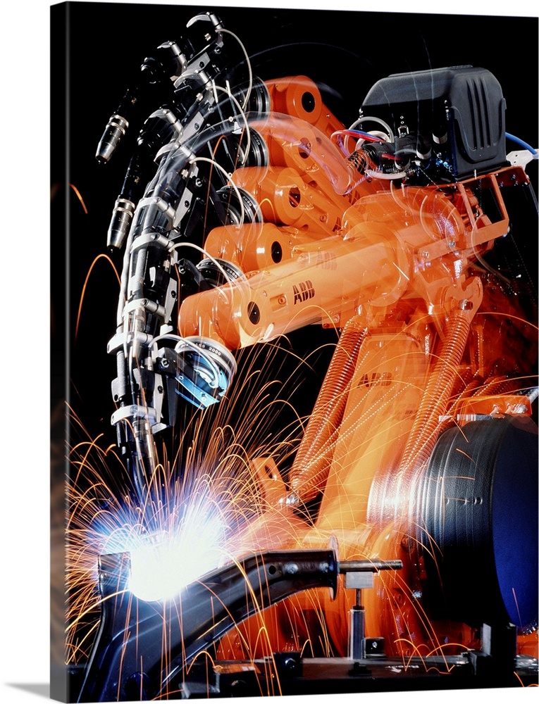 Robot welding in car production. Multiple exposure image of a robot arm spot-welding the suspension unit of a car. The wel...