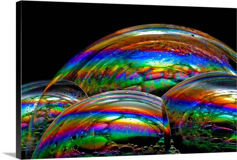 Soap bubble iridescence. Iridescence is the property of certain surfaces to change colour depending on the angle of light ...