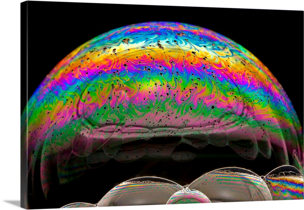 Soap bubble iridescence. Iridescence is the property of certain surfaces to change colour depending on the angle of light ...