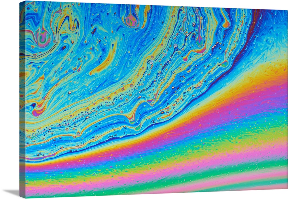 Colours in a soap film. The colours are produced by the interference of light waves reflected from the upper and lower sur...