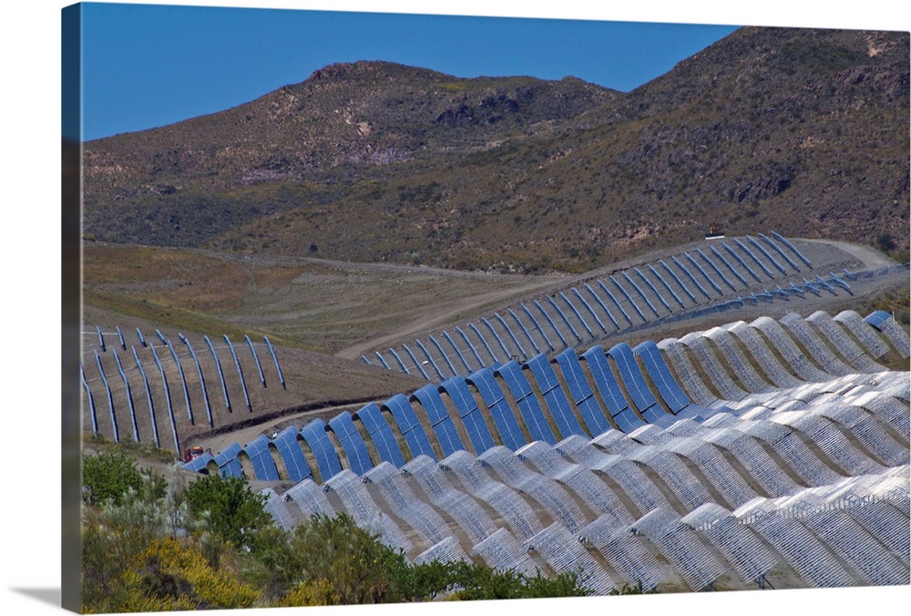 Solar power plant. Array of solar cells at a solar power plant in Cala San Pedro, Spain.