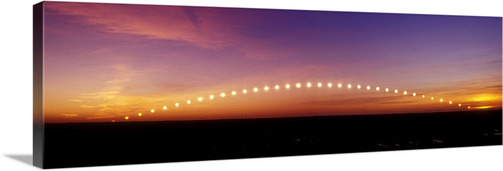 Time-lapse image of a suntrail. Time-lapse exposure showing the path of the sun as it rises from below the horizon and the...