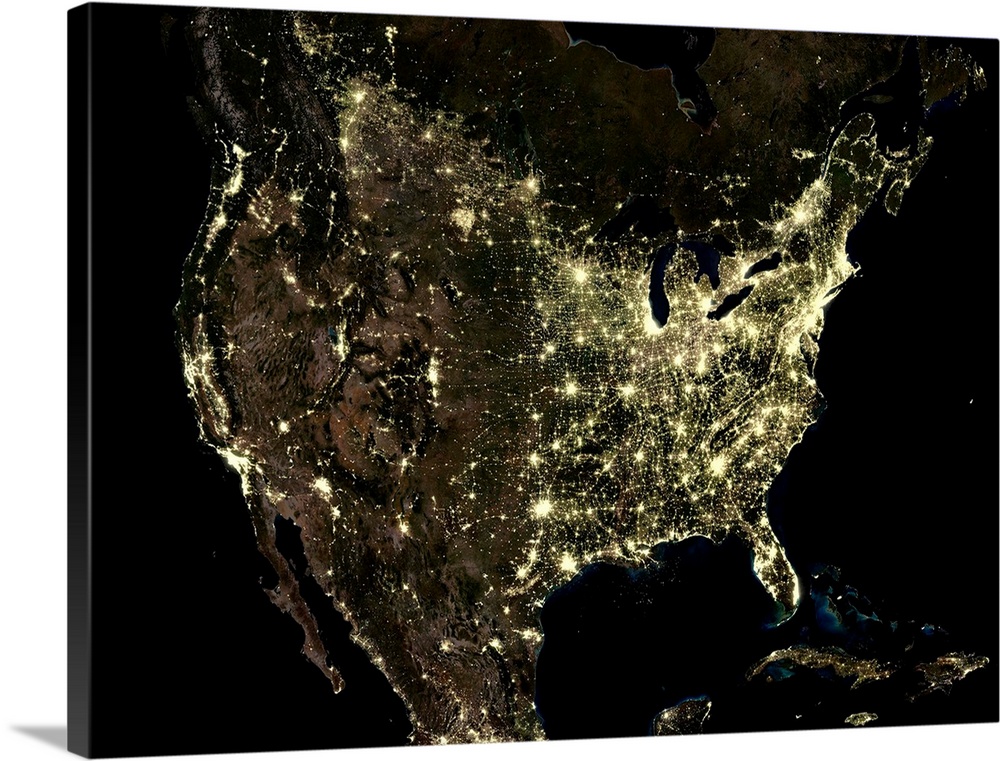 USA at night. Satellite image of the USA (centre) at night, showing urban and industrial lights (yellow). The Pacific Ocea...