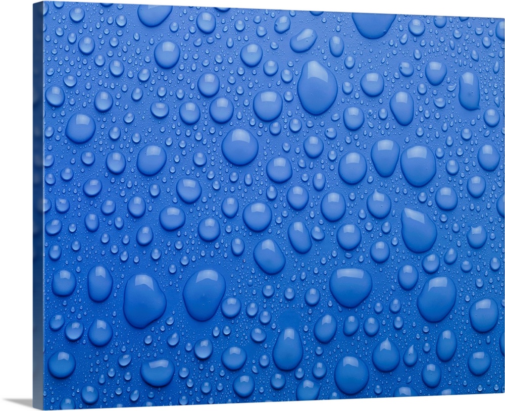 Water droplets as condensation on a flat surface.