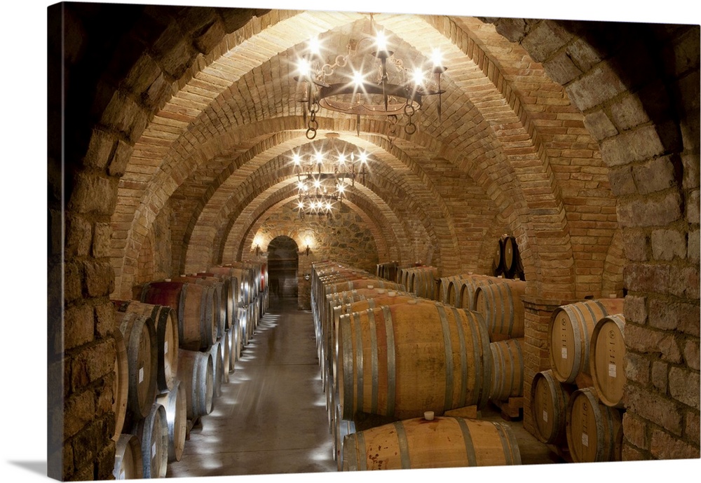 Wine storage cellar. Barrels stored in a wine cellar at Castello di Amorosa Winery in Calistoga, Napa Valley, California, ...