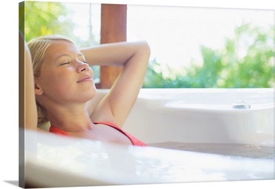 Woman Relaxing In Hot Tub