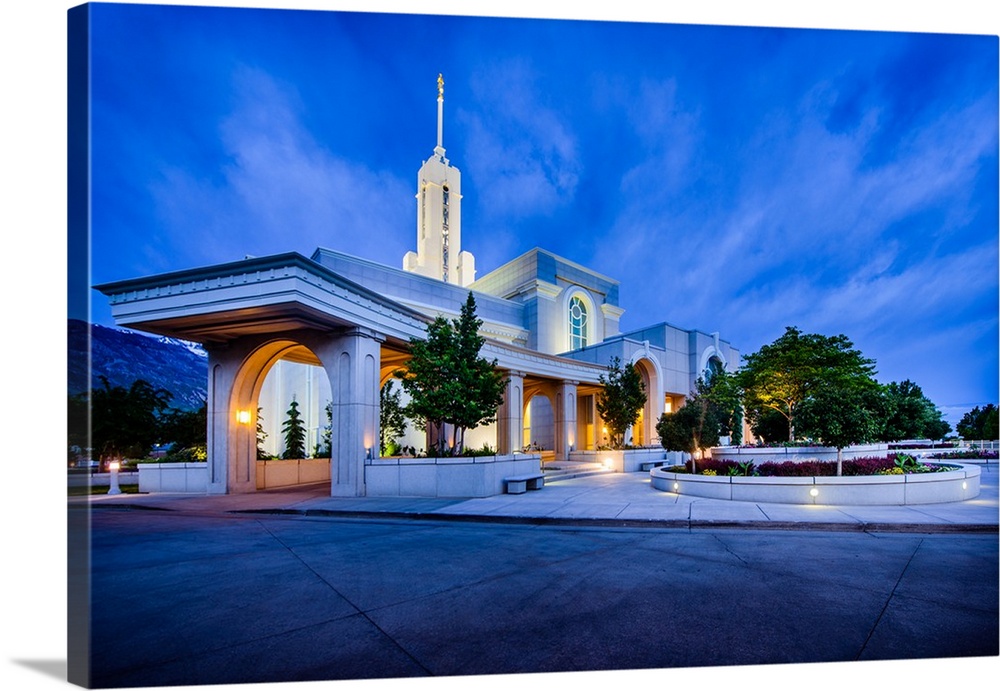 The Mount Timpanogos Utah Temple is located in American Fork, Utah. Its bright exterior offsets it from the hills behind i...