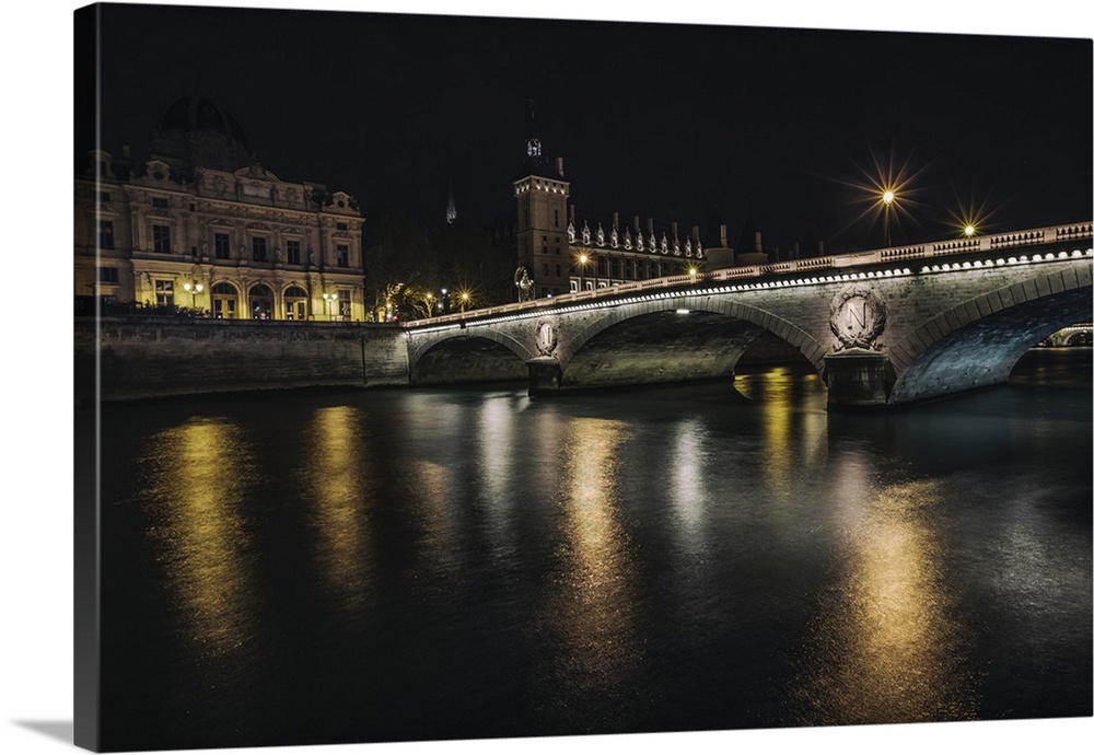 Bridge across the Seine at night in Paris, France