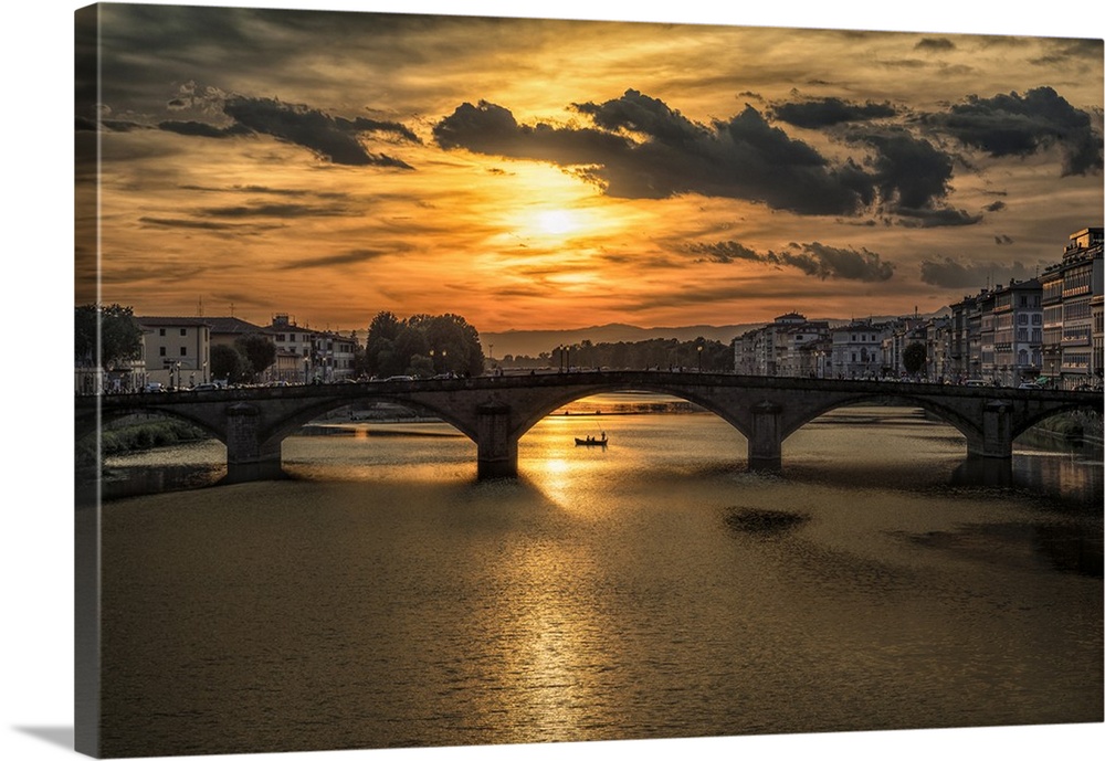 Bridge over the Arno River at sunset in Florence, Italy