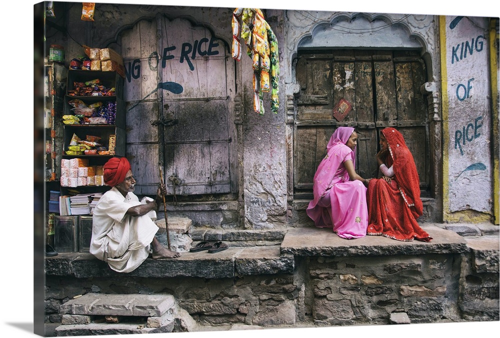 Colorful woman and man with turban in the Blue City of Jodhour, India.