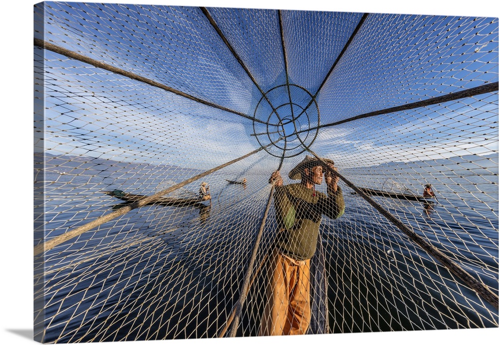 Fishermen at sunset in Inle Lake, Burma