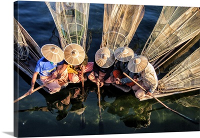 Fishermen on their longtail boats in Inle lake, Burma
