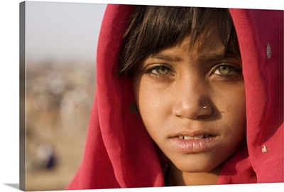 Girl with red scarf at the Pushkar camel festival, Rajistan, India