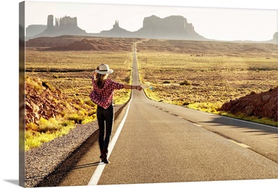 Hitchhiker on Forrest Gump highway by Monument Valley, Arizona