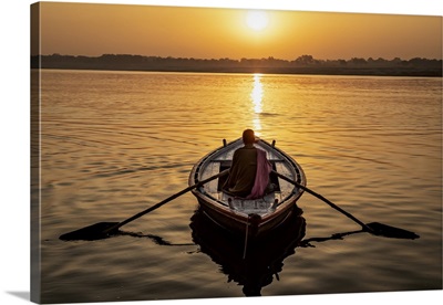 Man Rowing A Longtail Boat On The Ganges River, Varinasi, India