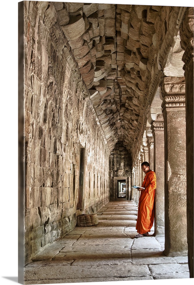 Monk reading in Angkor Wat, Cambodia