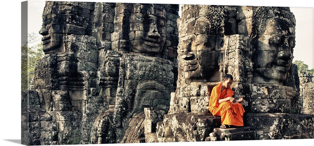 Monk reading in the Bayon of Angkor Wat Temple