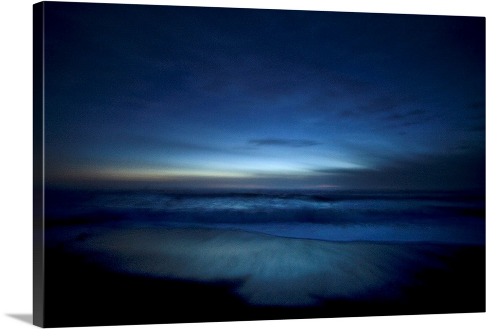Landscape, oversized photograph of deep blue ocean waters along the beach, surrounded by the darkness of dusk in Big Sur, ...