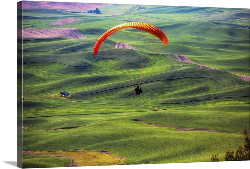 Paraglider above green the wheat fields in the Palouse