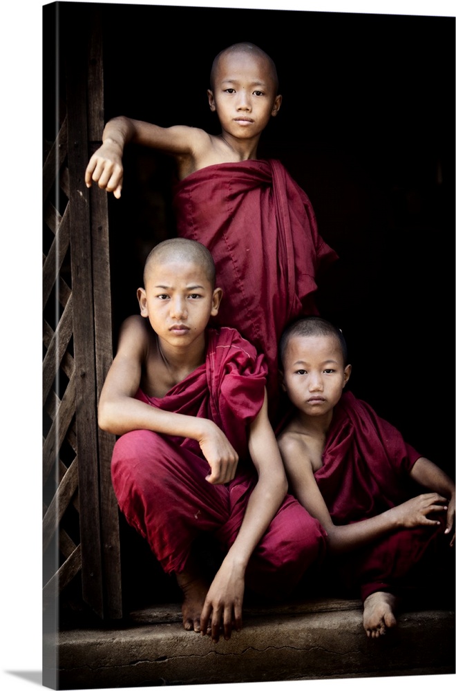 Portrait of three young monks in their monastery, Bagan, Burma