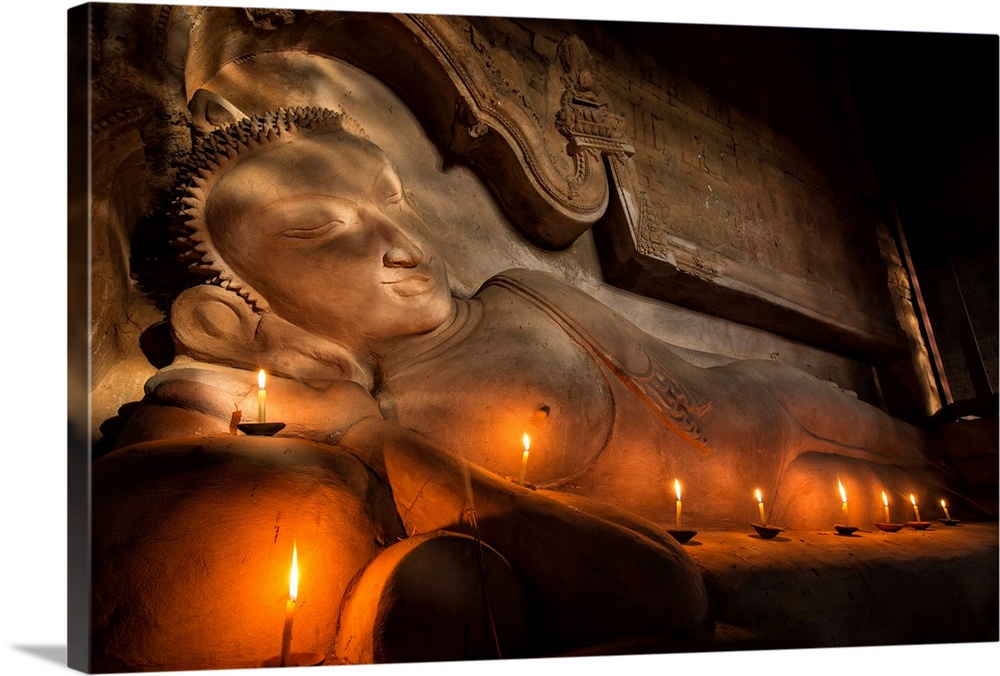 Reclining BUddha with candles in Bagan, Burma